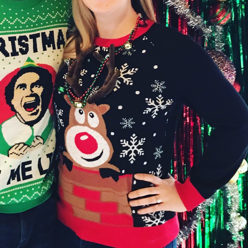 Ring toss reindeer Christmas sweater